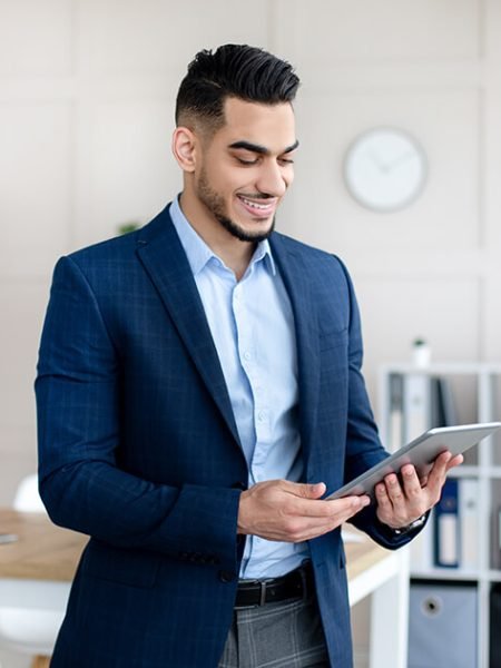 portrait-of-young-arab-man-in-formal-suit-working-2022-10-07-00-46-50-utc.jpeg
